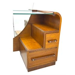 Early 20th century Art Deco walnut dressing table, featuring a large oval triptych mirror above a stepped base, fitted with four drawers and a central glass shelf, all raised on a plinth base