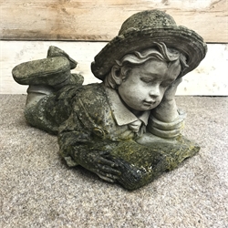  Pair composite stone figures of a boy and girl in prone position reading, H34cm, L50cm  