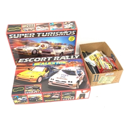 Scalextric - two sets Escort Rally with two Ford Escort Cosworth cars and Super Turismo with Opel Vectra and Audi A4 cars, both boxed; together with Pro Racing pack with two cars, boxed Mercedes car, unboxed Opel car, lap counter, low bridge and extra track