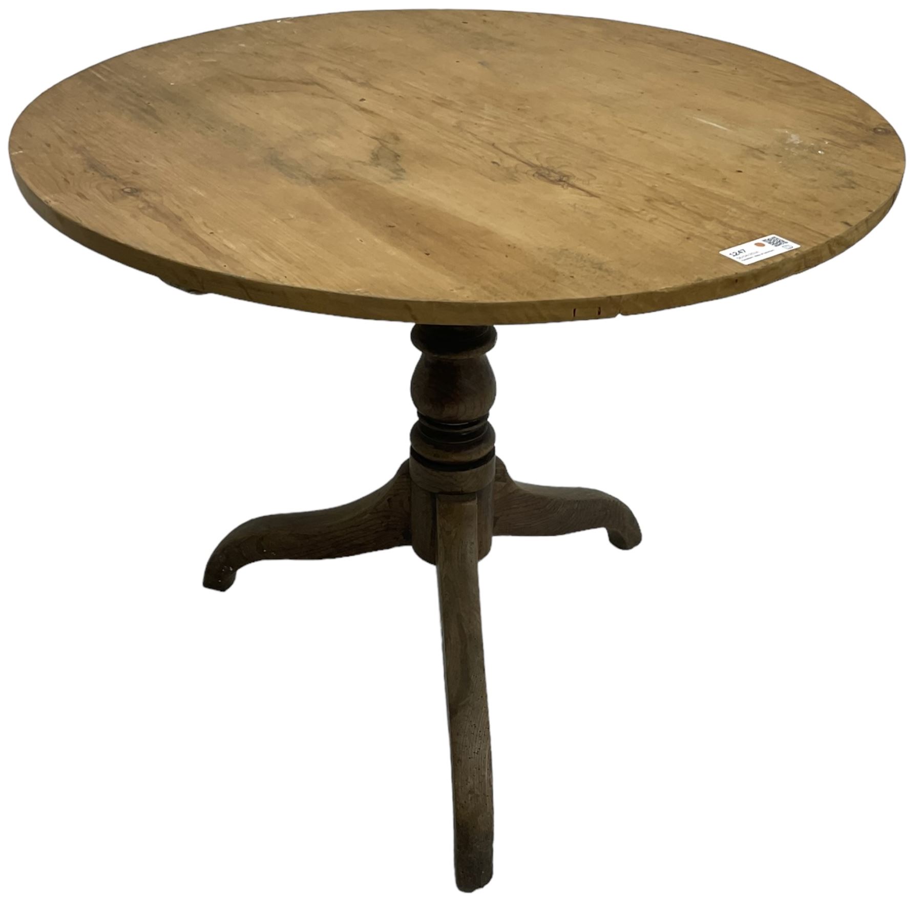 Early 19th century pine and elm tripod table; circular tilt-top over turned column and three splayed supports