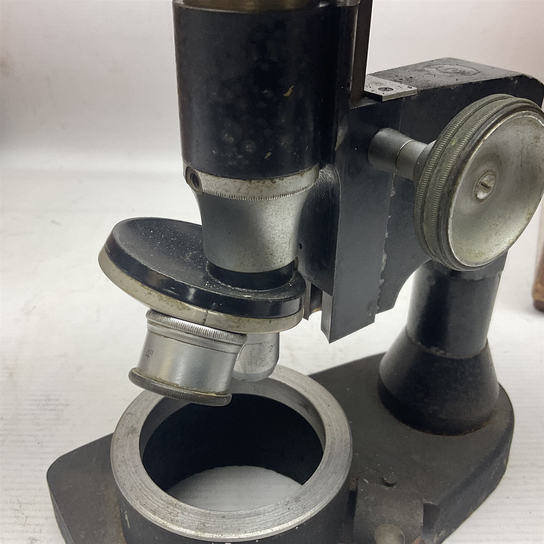 Four microscopes, including Cooke, Troughton & Simms no M467926, W Watson & Sons no 114758, W & J George & Beck Ltd no 36649 and one other 