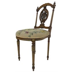 Late Victorian walnut side chair, arched cresting rail over carved and pierced splat depicting baskets and foliage, floral needle work upholstered seat, on acanthus carved and fluted turned supports