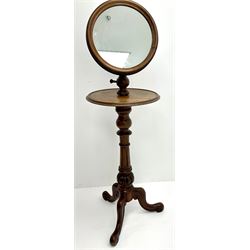 Victorian mahogany shaving stand, adjustable circular raised mirror over circular under tier, the turned and fluted column with egg and dart carved decoration, three out splayed scroll carved supports