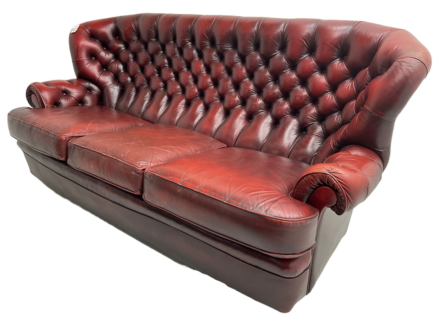 Wade - Georgian design three-seat sofa, high curved back over scrolled arms, upholstered in deep buttoned oxblood 'Pegasus' leather, on castors