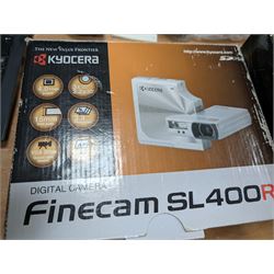 Yashica Electro 35mm film camera and a Kyocera Finecam SL400R, both boxed