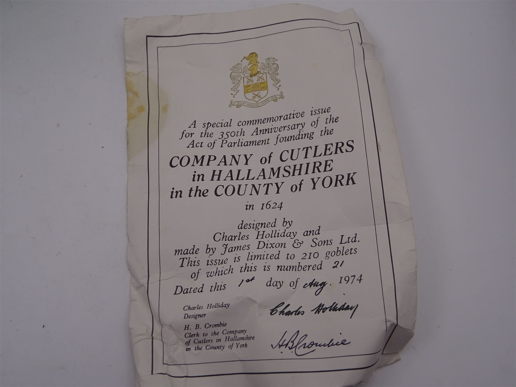 Modern limited edition silver goblet to commemorate the 350th anniversary of the Act of Parliament founding the Company of Cutlers, the tapering cylindrical bowl engraved with crest, with gilt interior and upon parcel gilt textured knopped stem and pierced circular foot, hallmarked James Dixon & Sons, Sheffield 1974, number 21/210 , in original fitted box with paperwork