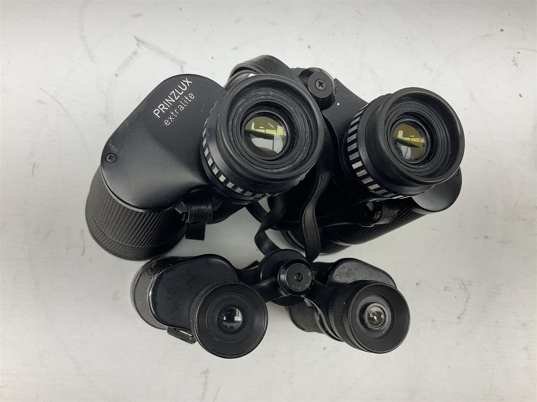 Eight cased pairs of binoculars, to include Zenith 10x50 field binoculars, Prinz 16x50, Prinzlux 10x50, Aquilus 10x35, etc, and a further binocular case