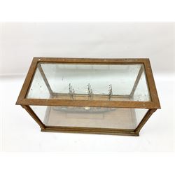Model of a four masted sailing ship, with rigging in an oak framed case with four glazed sides and top, H28cm, L44cm, D21.5cm
