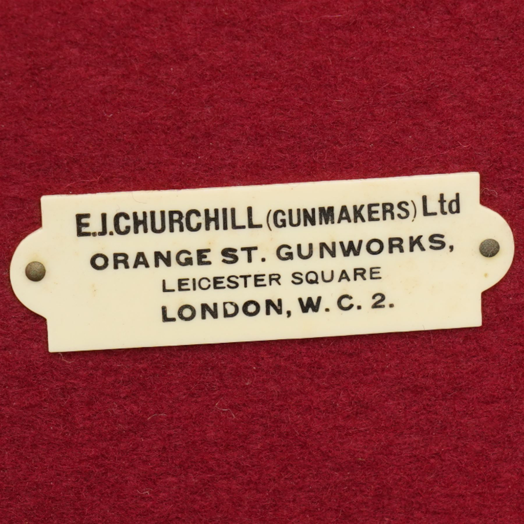 Churchill canvas shot gun case with leather corners and baize lined interior with trade label 'E J Churchill (Gunmakers ) Ltd ' with cleaning rods  and a leather 12 gauge cartridge belt