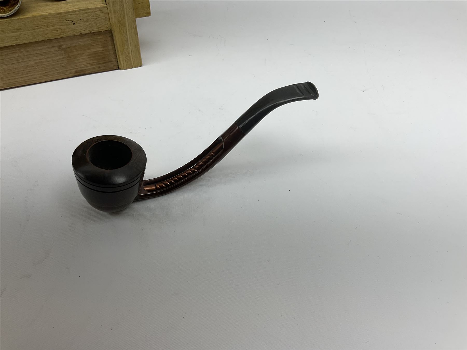 Pipes and two tiered wooden rack together with eleven pipers, including briar pipe carved as a wolf, Sea Dog straight pipe, John Brumfit pipe, meerschaum pipe ect, pipe rack H29.5cm