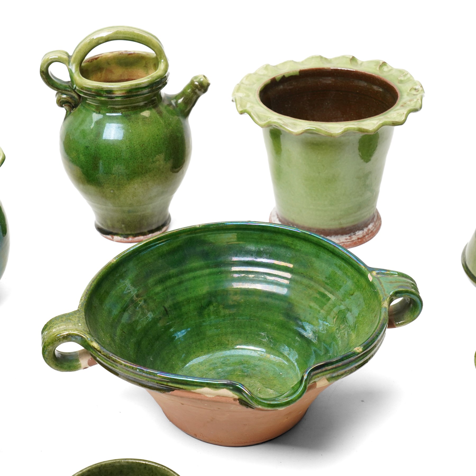 Collection of studio pottery, in green glazes, mostly unmarked, tallest H23cm (7)
