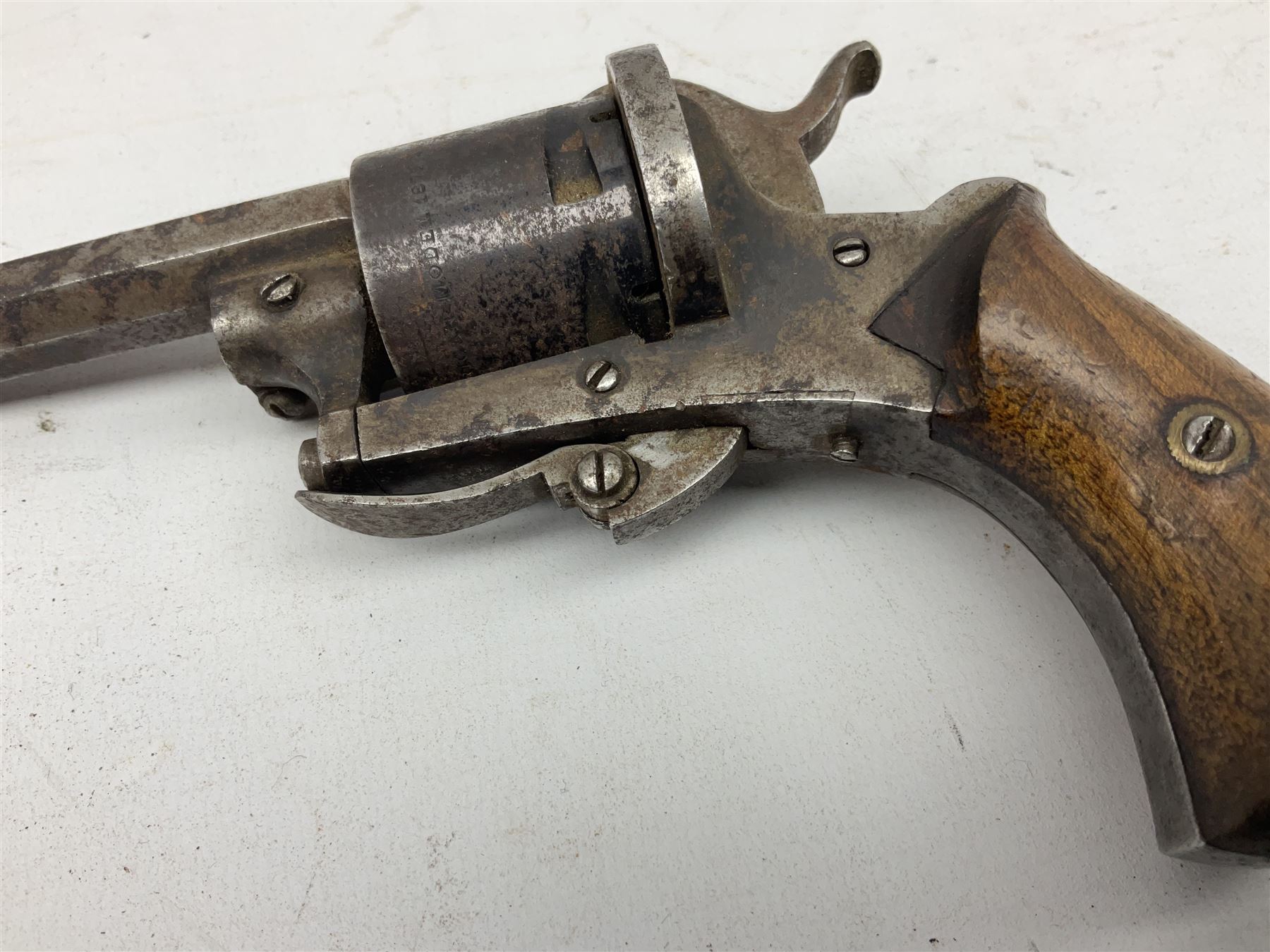 19th century 7mm five-shot pin-fire revolver, the cylinder marked 'The Savety (sic) American Revolver 1879', with folding trigger and two-piece walnut grip L18cm