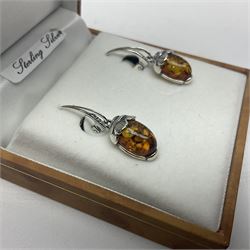 Pair of silver and Baltic amber acorn pendant earrings, stamped 925, boxed 