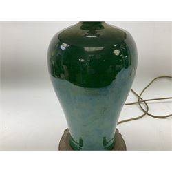 Green baluster form crackle glaze table lamp, with ornate brassed base and pleated fabric shade