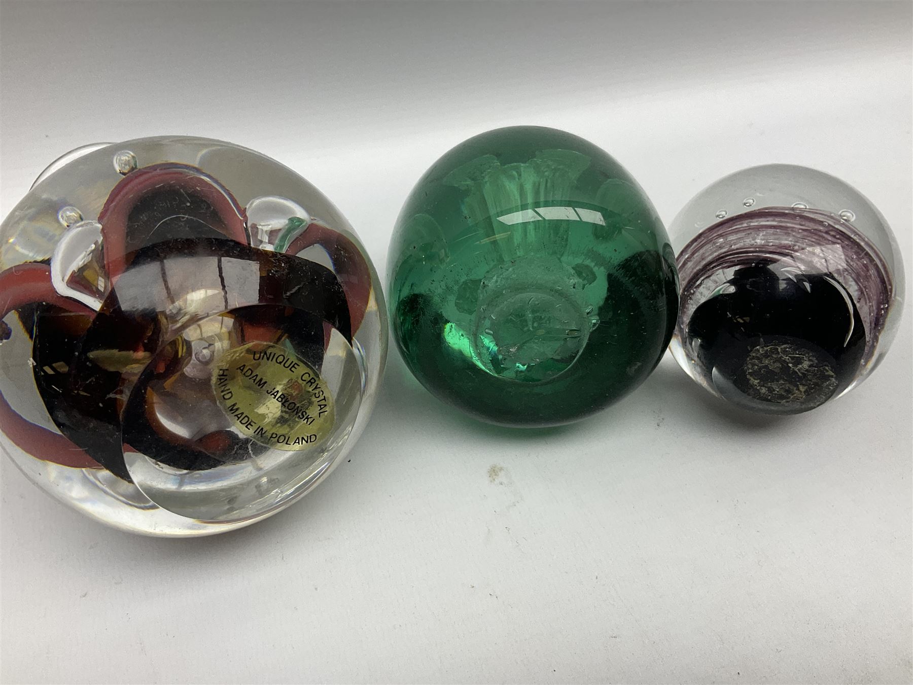 Victorian green glass dump paperweight with internal foil flower ...
