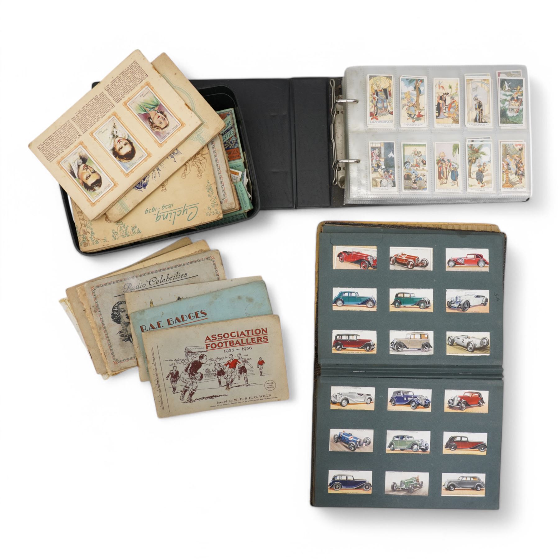 Large collection of cigarette cards, comprising approximately seventeen albums including RAF badges, Association Footballers 1935-1936, Air Raid Precautions, Motor Cars, and various other 'Wild Woodbine' boxes 