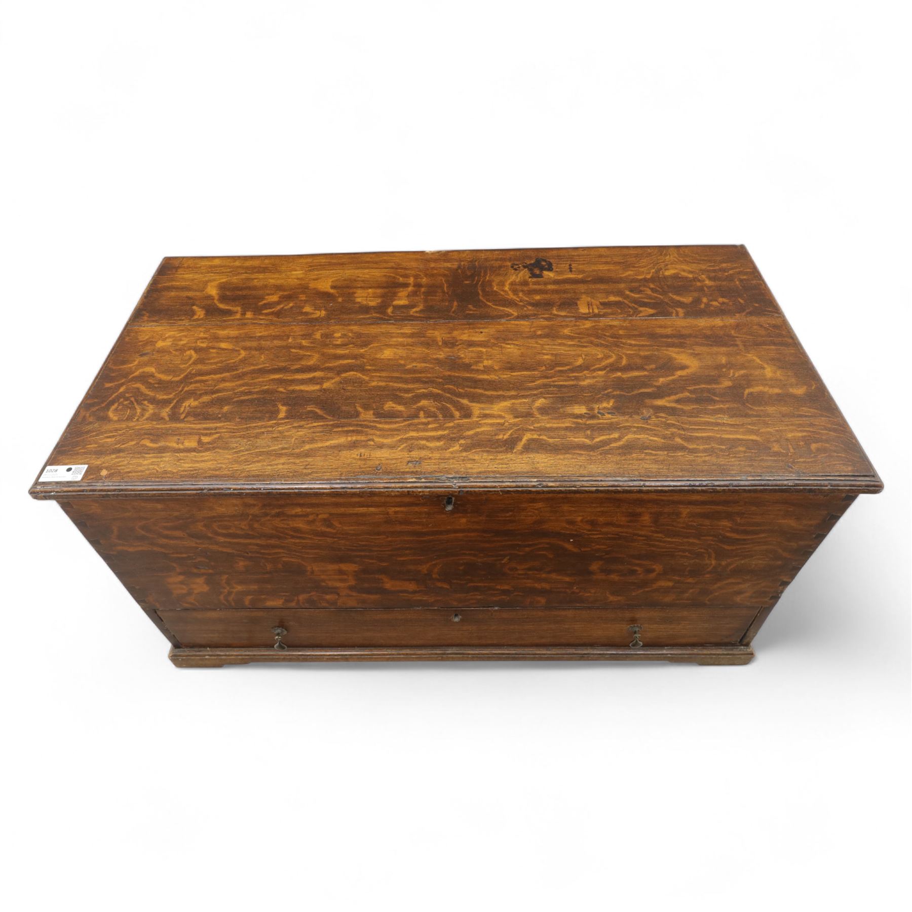 19th century oak blanket chest, rectangular hinged plank top with moulded edge, plain sides fitted with iron carrying handles, single full-width drawer to base with brass drop handles, on moulded plinth base