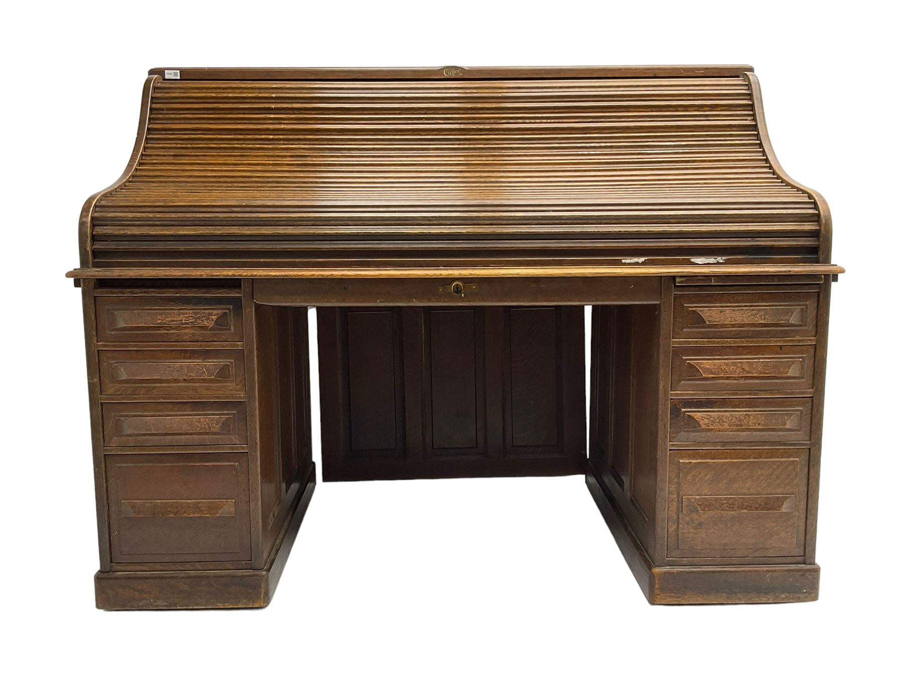 Cutler - early 20th century American oak tambour roll-top desk, the twin pedestals fitted with four graduating drawers