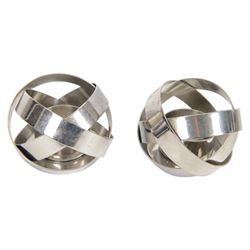 Pair of Georg Jensen stainless steel candleholders and matching pair of tealight holders, both designed by Alken & Bengtsson, with original boxes 