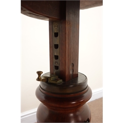  Victorian mahogany cantilever two-sided reading or bed table, shaped top with  adjustable rests on turned column with locking handle, the shaped base with three bun feet, inset steel ball castors, W93cm, D49cm,   
