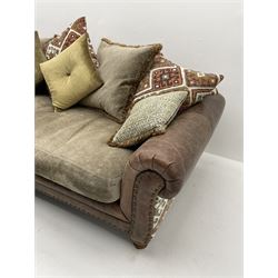 Alexander James - Grand two sectional sofa upholstered in studded leather and fabric, with contrasting kilim patterned scatter cushions, scrolling arms and turned front supports 