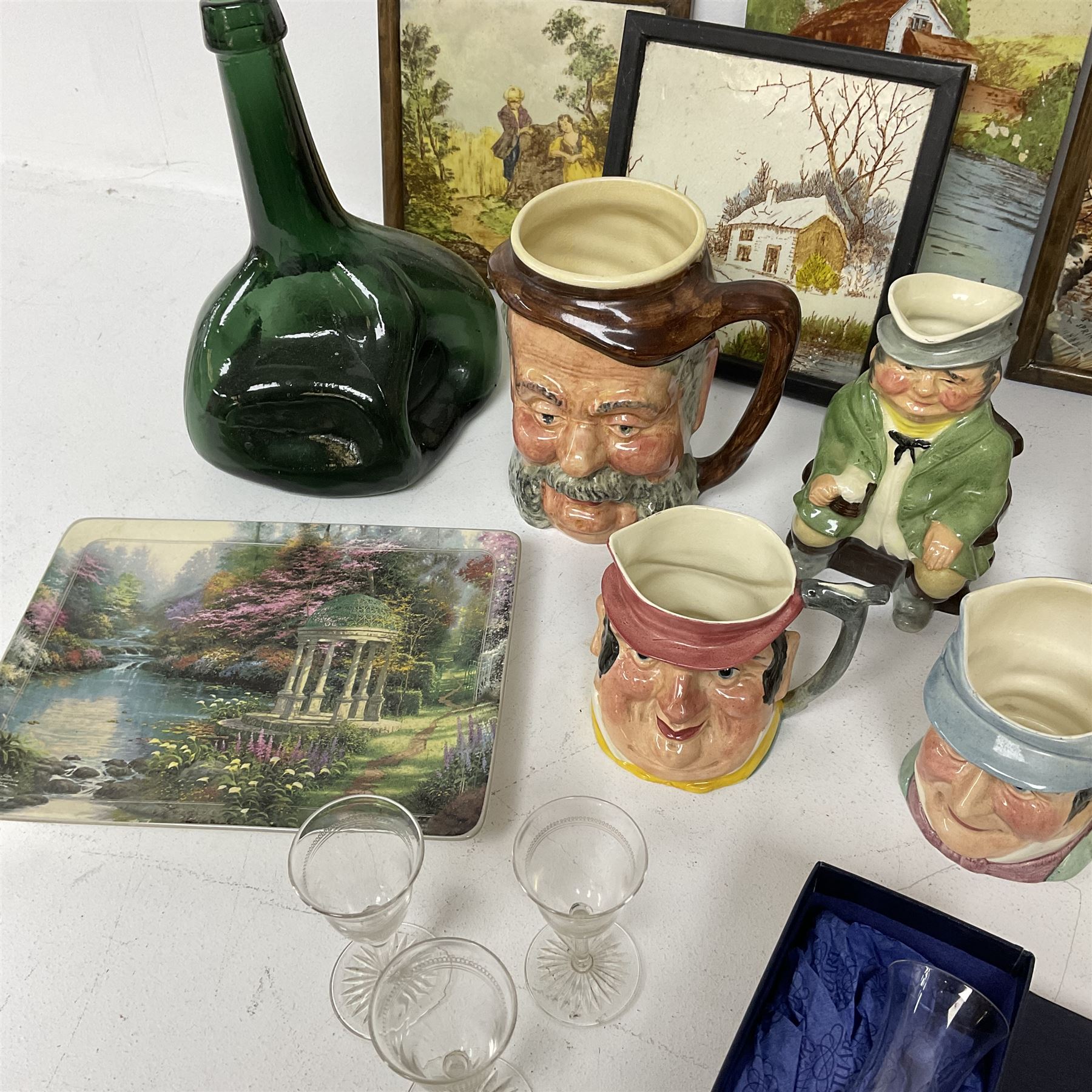 Dimpled green glass bottle, together with painted tiles, a collection of character jugs etc 