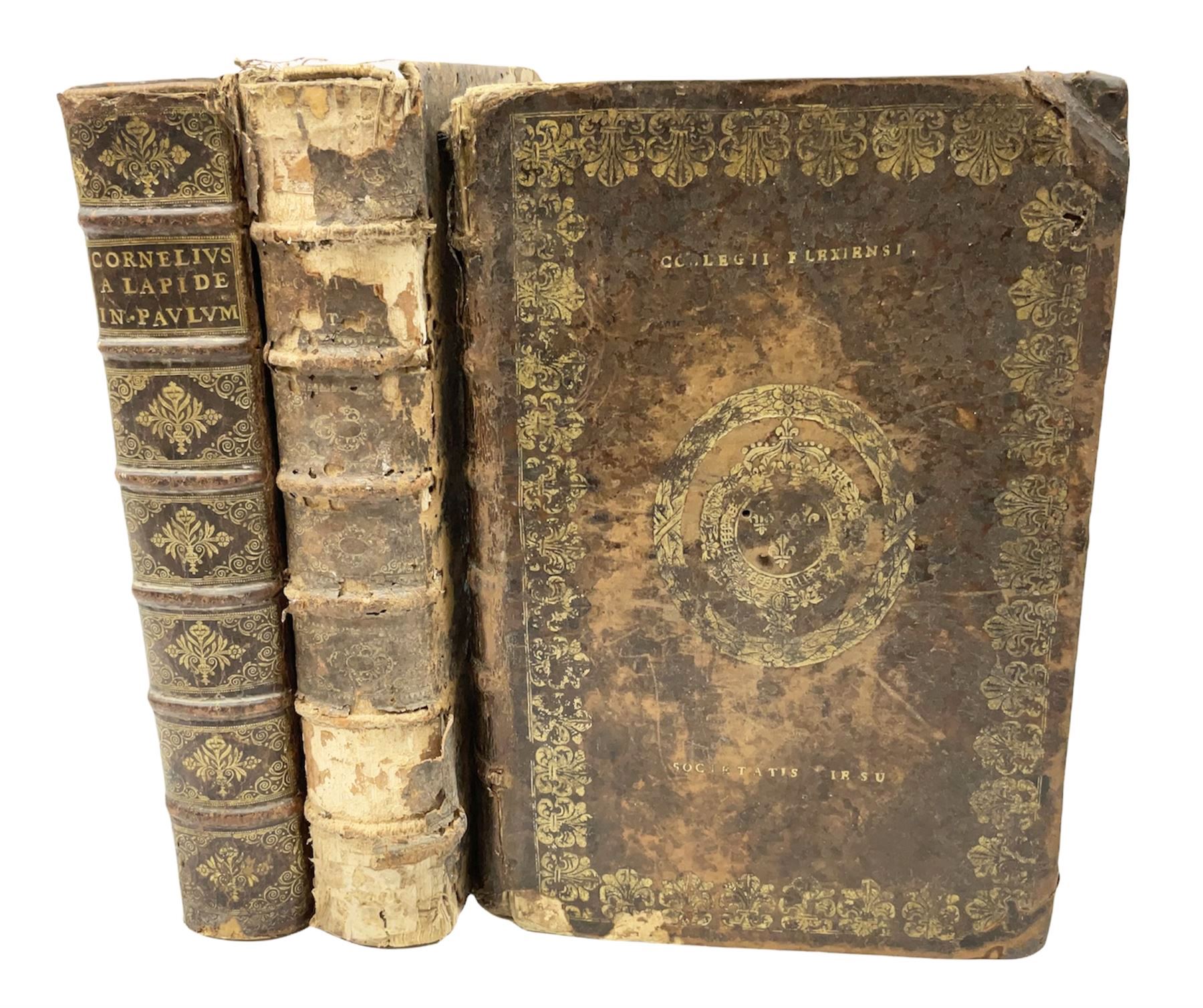 Three 17th century Lugduni (Lyon) printed books each with engraved title page in red and black comprising R.P. Corn Cornelii A Lapide .... Tomus Primus. 1690; R.P. Cornelii Cornelii A Lapide .... 1683; and Hortus Pastorum Sacrae Doctrinae Floribus Polymitus .... 1668. All folio with full calf bindings (3)
