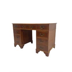 Yew wood twin pedestal desk, fitted with eight drawers, inset leather writing surface