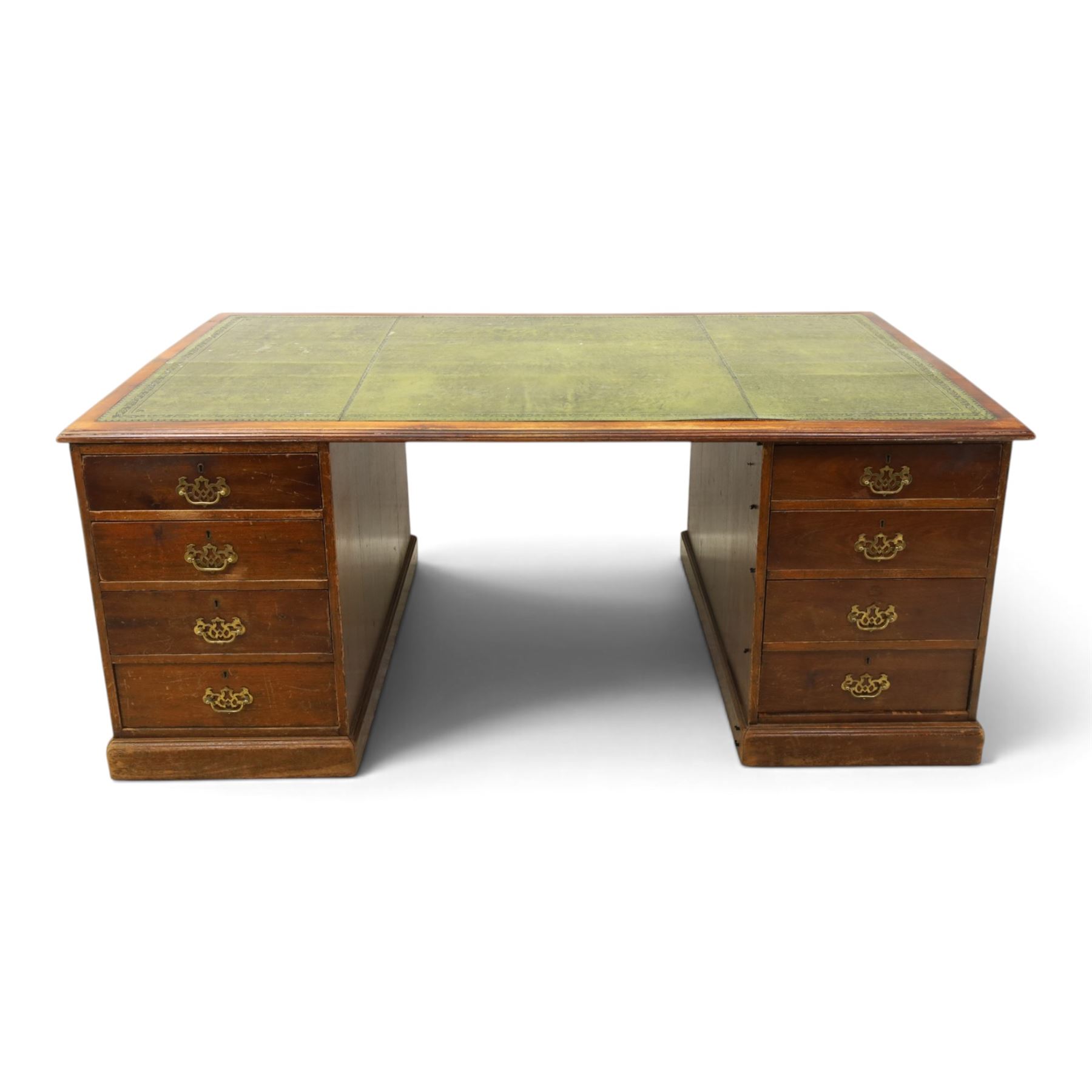 Edwardian mahogany office desk, recatangular top with green inset leather writing surface, fitted with two banks of four drawers, brass swan neck handles with ornate backplates