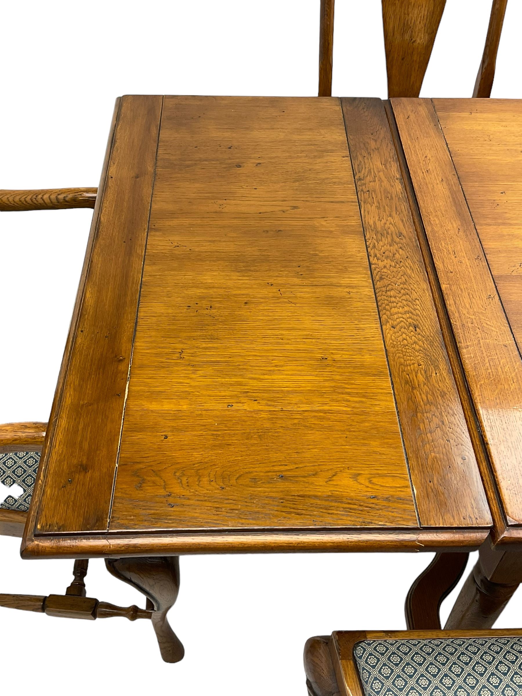 Late 20th century oak dining table, rectangular top with two draw leaf extensions, on turned supports united by moulded hayrake stretchers (180cm - 278cm x 90cm, H76cm); set of eight (6+2) oak dining chairs, shaped cresting rail over shaped splat back, upholster drop-in seat, on cabriole supports united by turned H-shaped stretchers 