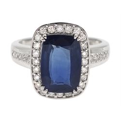 White gold cushion cut sapphire and diamond cluster ring, stamped 18K, sapphire approx 3.60 carat
