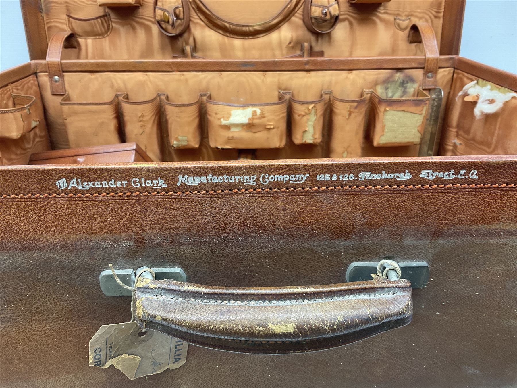 Vintage leather traveling case with monogram to cover, with watered silk lining to interior, and some contents, plus a further vintage travel case, (2)