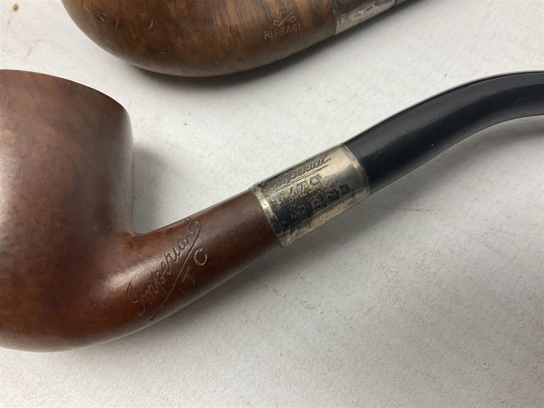 Collection of eight silver mounted pipes, comprising a briar wood Imperial ITC example with silver collar hallmarked A.W Birmingham 1903, horn handled example with silver collar hallmarked LB, probably Louis Blumfeld, Birmingham 1900, three examples marked B.W, one marked Globe A.O.C, Blumfeld's Best Briar pipe marked BBB and Riseagle example, together with two further pipes (10)