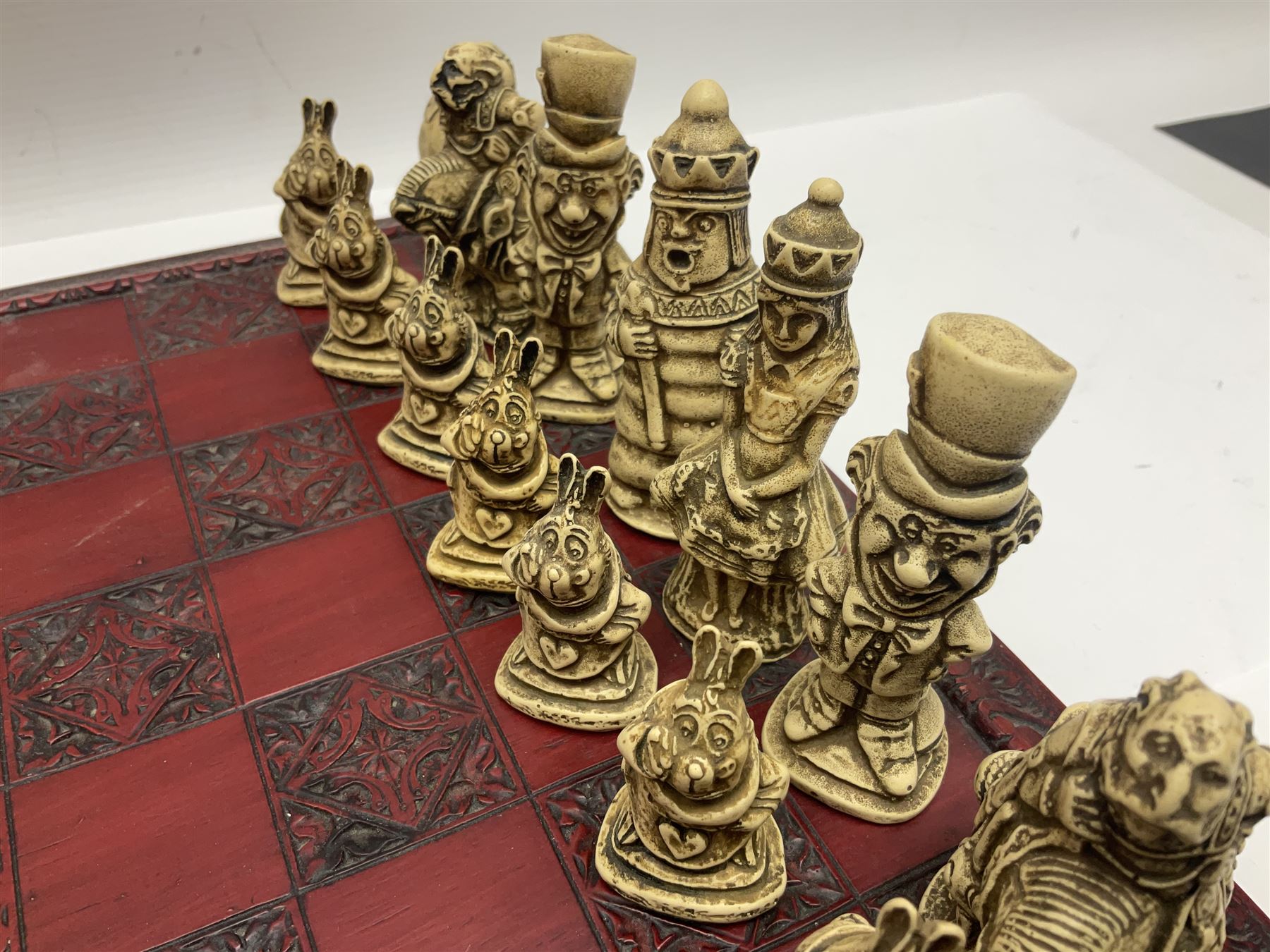 Alice in Wonderland themed chess set, with a complete set of composite figures, modelled as characters including Alice, Tweedledum and Tweedledee, the White Rabbit and the Mad Hatter, etc