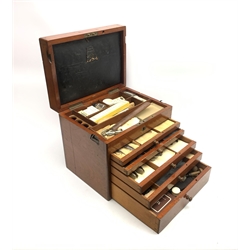  Dentistry - Late Victorian mahogany Dentists cabinet by C. Ash & Co, hinged cover above six long graduated drawers, enclosing a comprehensive arrangement of implements, pharmaceutical bottles, tools, modelling wax, porcelain teeth, 