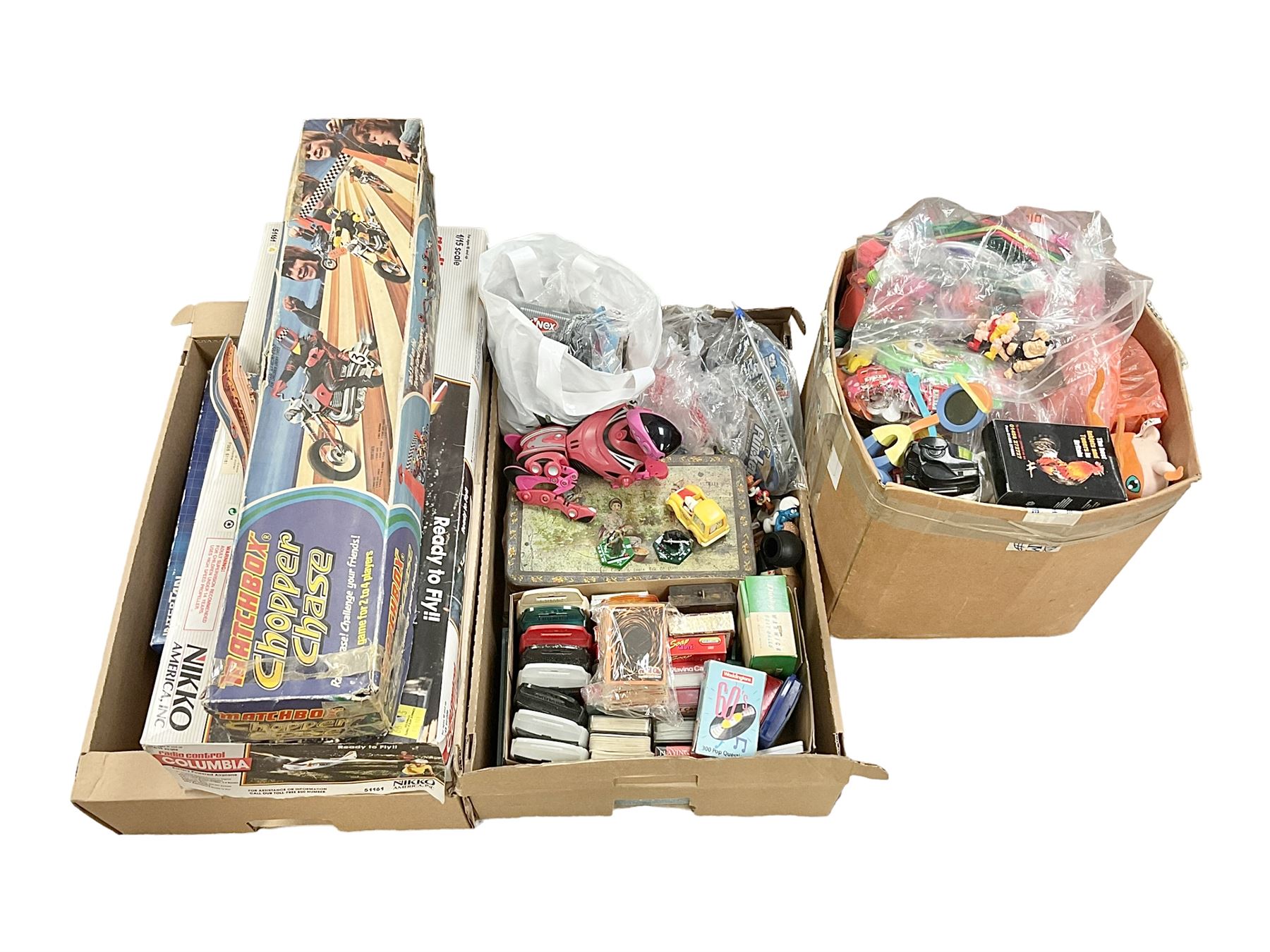 Large quantity of modern toys to include Matchbox Chopper Chase, Nikko battery control airplane, small amounts of K’nex, Meccano, playing cards to include Yu-Gi-Oh cards, keyrings etc in three boxes 
