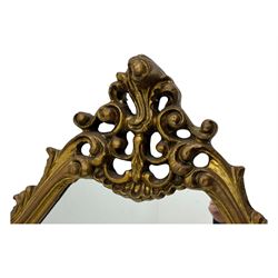 Victorian design gilt framed overmantel mirror, the arched and moulded frame adorned with scrolling foliate motifs and acanthus leaves, surmounted by a pierced cartouche, plain mirror plate, resting on a shaped base