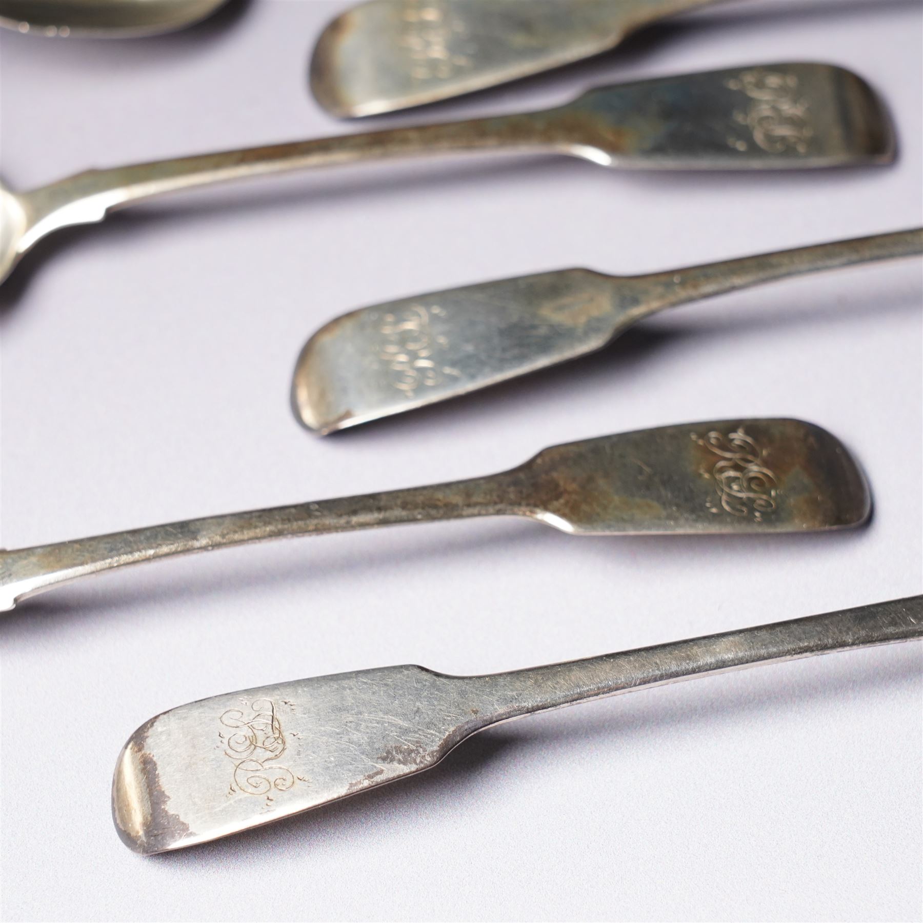 Set of six George IV silver fiddle pattern tea spoons London 1827 engraved with initials and a pair of later sugar tongs