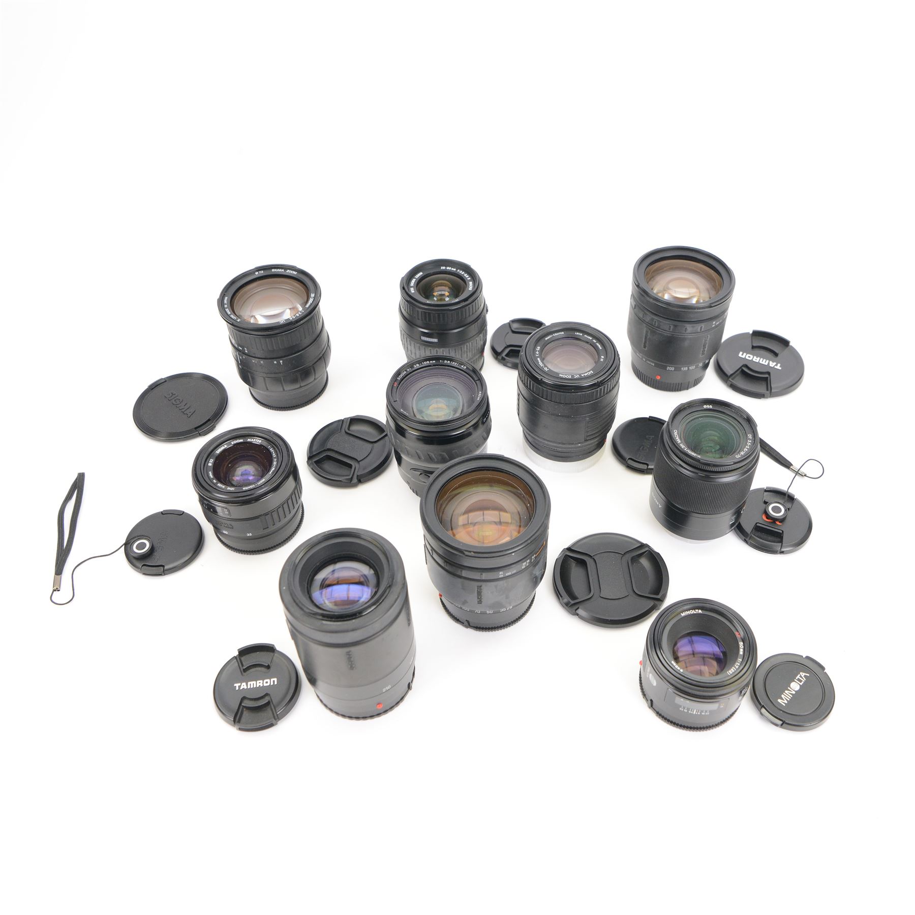 Ten camera lenses, comprising Minolta AF Zoom Xi 28-105mm 1:3.5 (22)-4.5 , Tamron AF Aspherical 28-200mm 1:3.8-5.6, two Tamron AF 80-210mm 1:4.5-5.6, Sigma Zoom 28-80mm 1:3.5-5.6 macro, Sigma Zoom 28-200mm 1:3.8-5.6 UC, Sigma UC Zoom 70-210mm 1:4-5.6, Sony DT 3.5-5.6/18-70 0.38m/1.3ft macro, Minolta AF 50mm 1:1.7 and Sigma Zoom Master 1:3.5-4.5 f=35-70mm