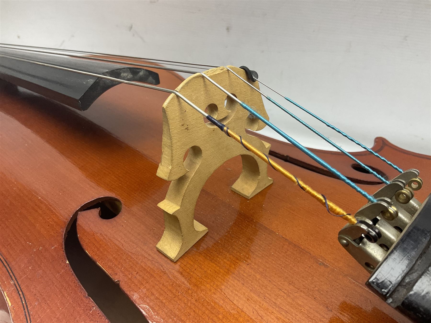 German half-size cello with 69cm two-piece maple back and ribs and spruce top; L112.5cm overall; in soft carrying case with two bows