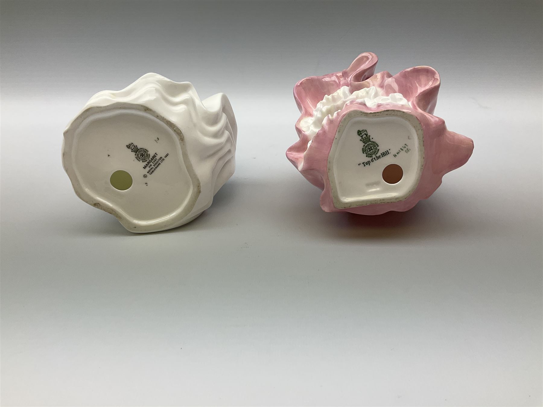 A group of figures, comprising four Royal Worcester examples, The Milkmaid, Lady Emma, Lady Cicely, Lady Hannah, three Royal Doulton examples, Top o' the Hill HN1849, Margaret HN2397, Fair Lady HN3216, two Coalport examples Fairest Flowers Heather, and Pansy, and a Wedgwood figure commissioned by Spink, The Imperial Banquet. 