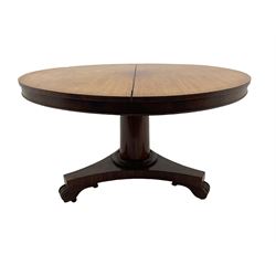 Victorian mahogany circular breakfast table, the tilt top raised on a turned column and trefoil base, with feet and castors
