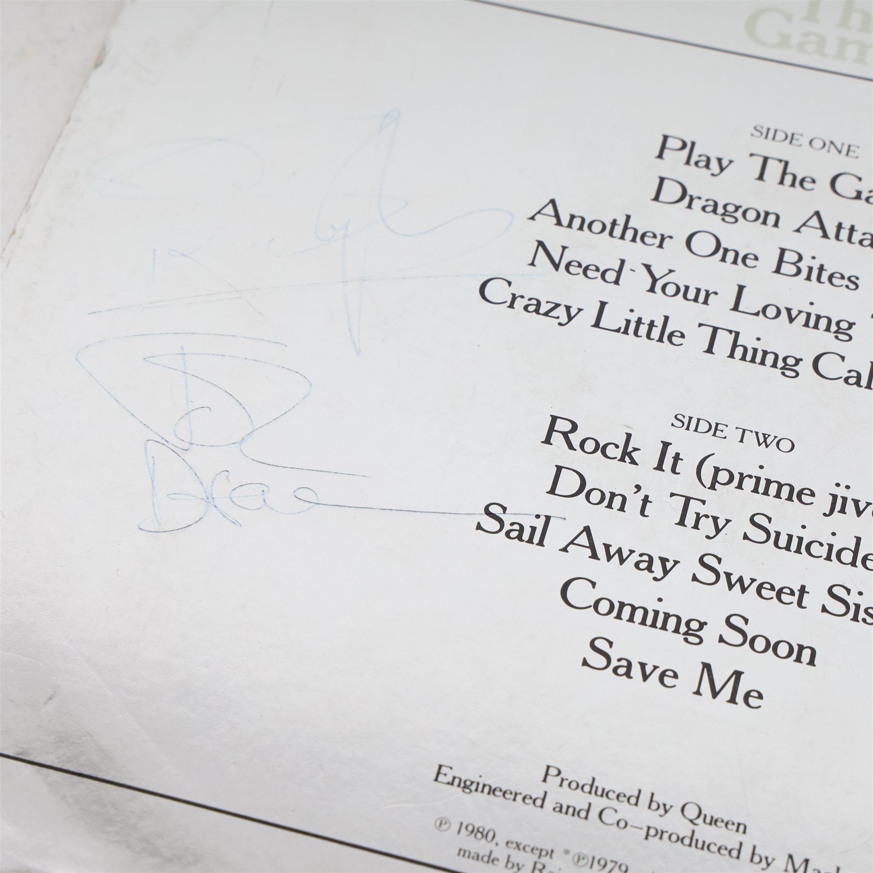 Queen 'The Game' signed vinyl record, signed to the reverse of the mirrored silver sleeve by Freddie Mercury, Roger Taylor and John Deacon, released by EMI records 1980

Provenance by vendor repute: Queen played at Elland Road in Leeds 29th May 1982; the vendor met the band the day before and had this record signed by the three members, but Brian May had not yet got off the train. The vendor called up the hotel and impersonated the band's then manager, Gerry Stickles, (by putting on an Australian accent!) to ask what time the band were arriving, then waited for them at the hotel.