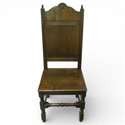 20th century oak refectory style dining table and eight chairs (6 + 2), rectangular top on two large carved baluster pedestal supports with leaf decoration, on splayed trestle bases joined by a stretcher, with eight matching oak dining chairs, each with Yorkshire rose carved cresting rail, panel back and solid seat, raised on turned supports united by stretchers