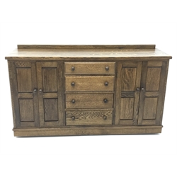  Medium oak sideboard, raised back, four graduating drawers flanked by four cupboards, panelled sides, W168cm, H96cm, D47cm  
