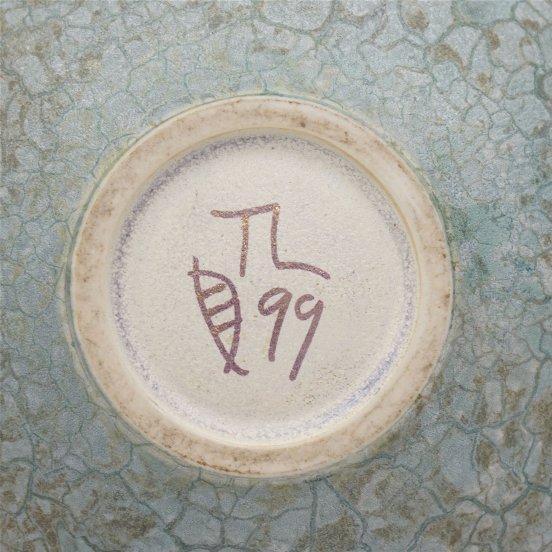 Tony Laverick (1961-); Charger painted with crossing horizontal and vertical lines of marbled blue and orange, the base signed with initials and dated '98, D42.5cm and a smaller bowl, signed with initials and dated '99, D26cm (2)