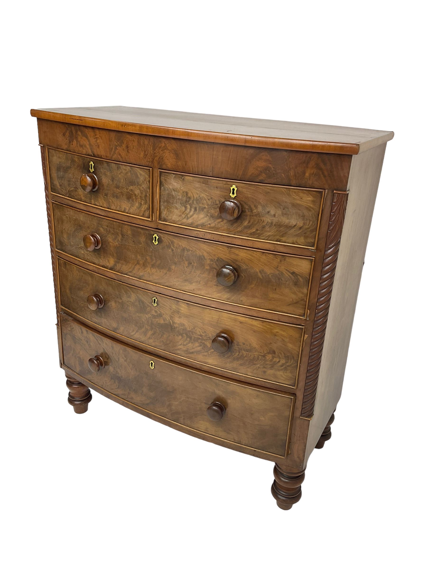 Late 19th century mahogany bow-front chest, fitted with two short drawers over three long drawers each with cockbeaded fronts, raised on turned feet