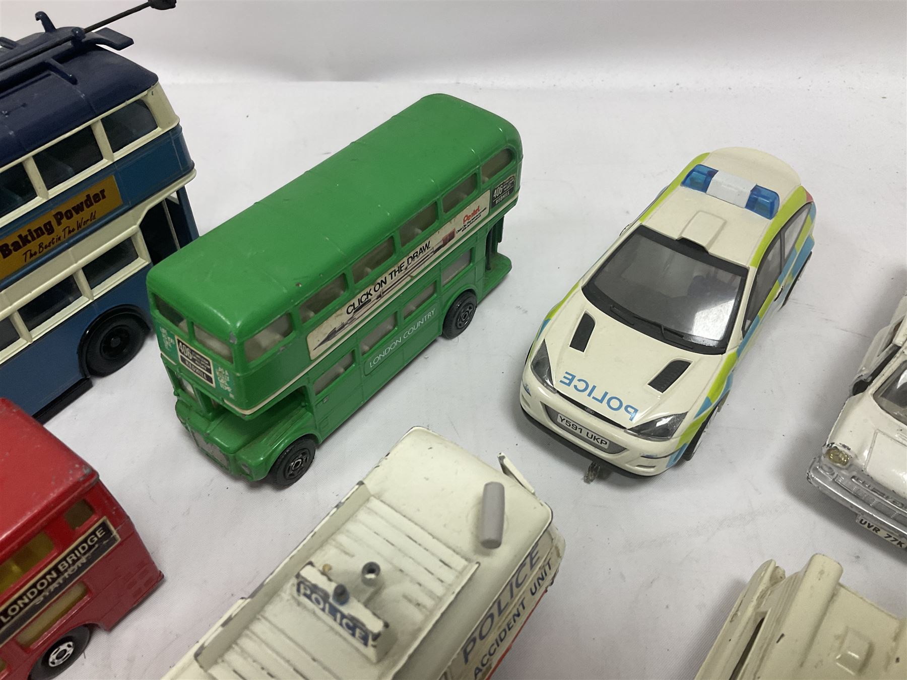 Corgi/Dinky - twenty-four unboxed and playworn die-cast models, predominantly emergency vehicles and buses; including Autocar Isobloc, Superior Criterion Ambulance, Ford Transit Police Vans, Chevrolet Impalas, Minissima, Ausin Mini Police van etc (24)