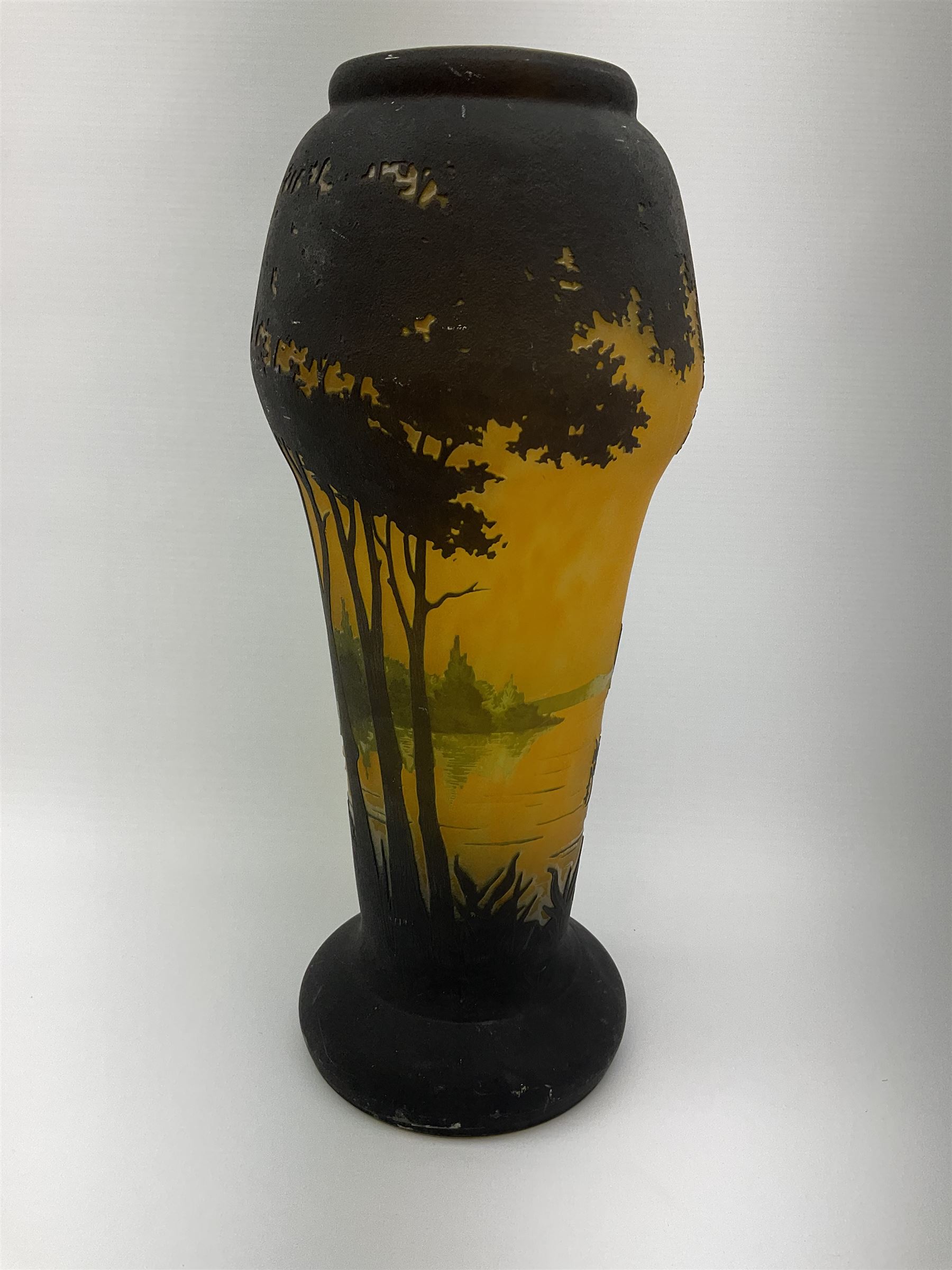Reproduction Daum Nancy art nouveau style overlay and cut glass vase  decorated with woodland and a lake scene on a yellow ground, H35cm. 
