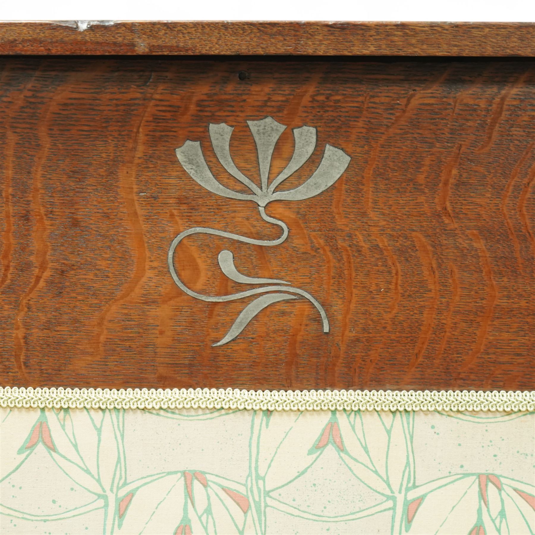 James Shoolbred & Co. (1814-1934) - Arts & Crafts high-back oak settle or hall-bench, the projecting cresting rail over a frieze decorated with stylised poppy pewter inlays, the drop-in sprung seat beneath high back and arms, flanked by tapering uprights terminating to shaped stile feet, upholstered in Archibald Knox patterned fabric with the original tapestry and horsehair upholstery beneath, applied plaque by James Shoolbred to underside, with stamped serial number W1573, circa 1890